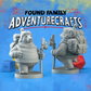 Two gray 3d bear miniature figurines with backpacks, warm hats and walking sticks on a blue background, featuring 'Found Family AdventureCrafts' text.