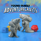 Two fish-like reverse mermaid creature miniatures with dice on a blue background, featuring 'Found Family Adventurecrafts' text.